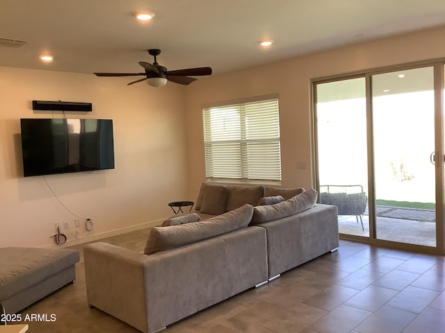 living area featuring recessed lighting, visible vents, tile patterned floors, and ceiling fan