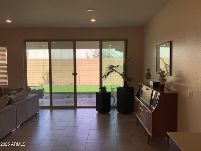 doorway with tile patterned floors and recessed lighting