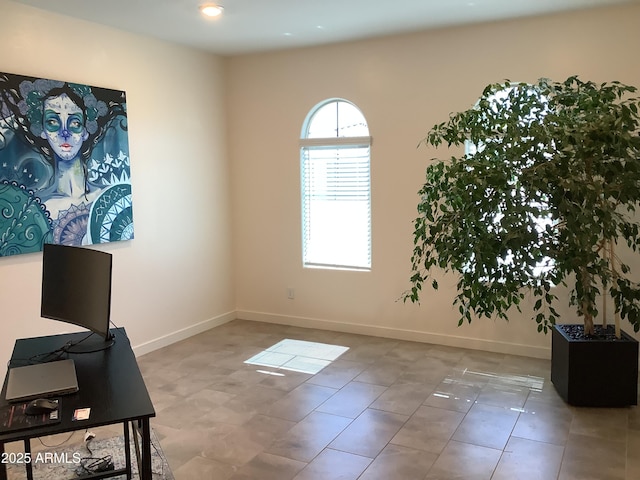 office area featuring baseboards and tile patterned flooring