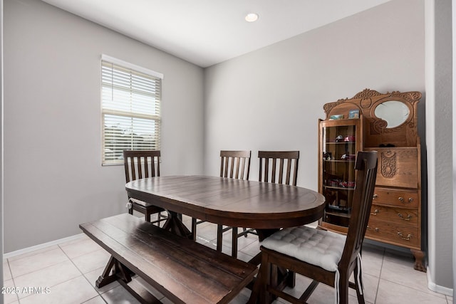 dining room with light tile patterned floors, baseboards, and recessed lighting