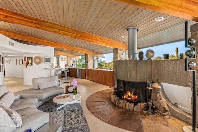 tiled living room featuring sink, wooden ceiling, and beam ceiling