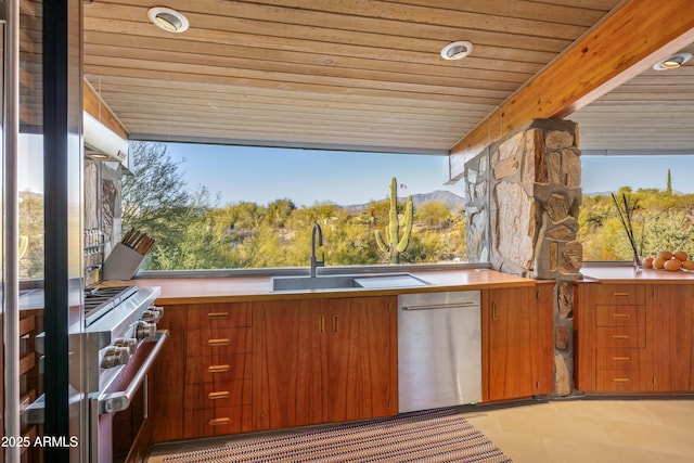 view of patio with a mountain view and sink