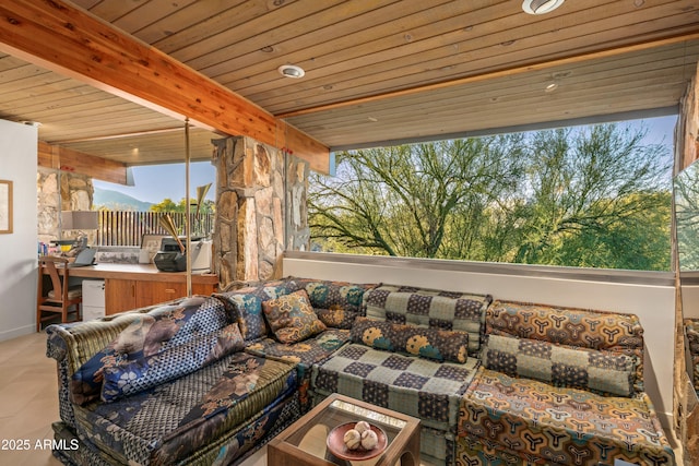 exterior space with beam ceiling and wooden ceiling