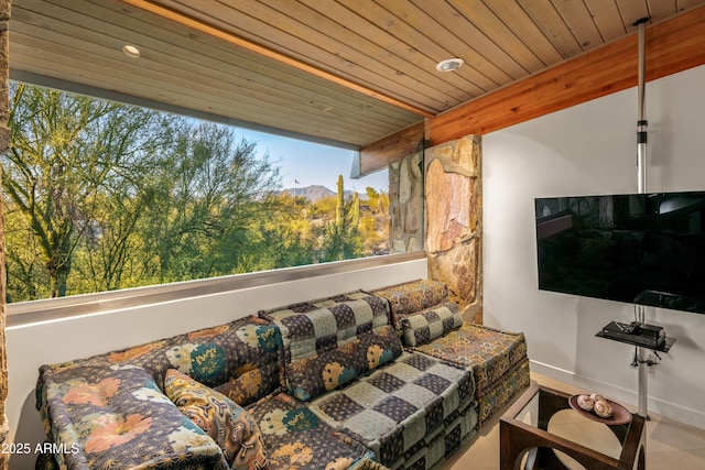 living room featuring wooden ceiling and beamed ceiling