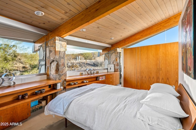 bedroom featuring beamed ceiling and wooden ceiling