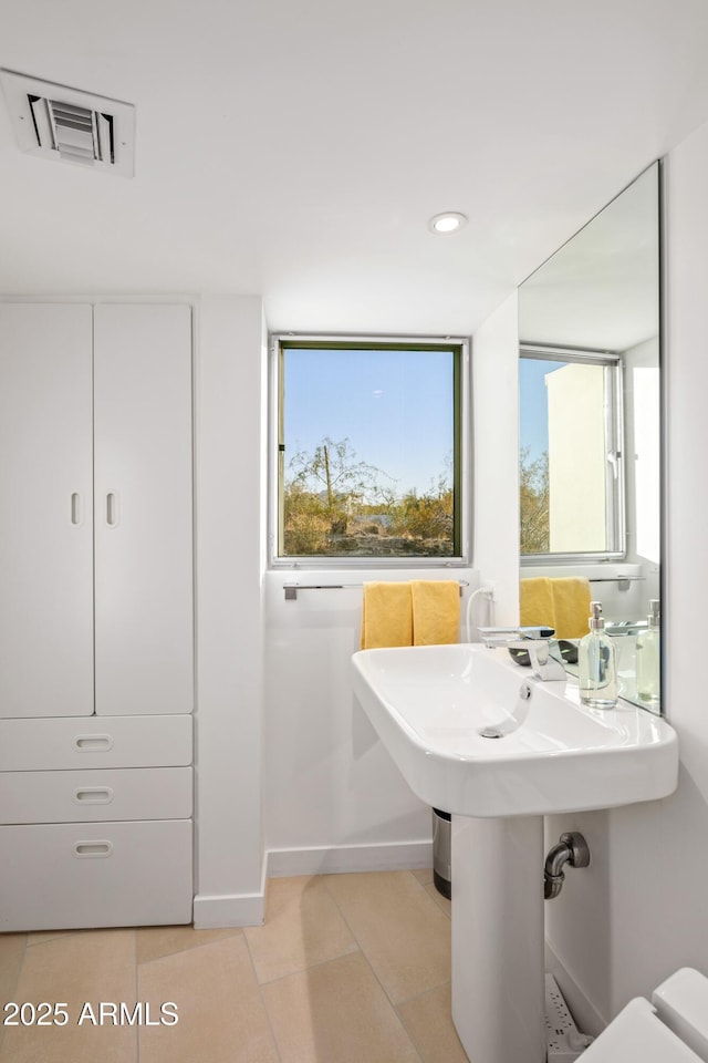 bathroom with tile patterned flooring