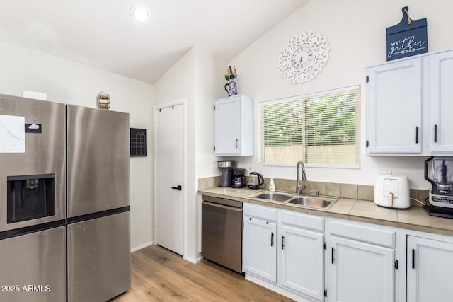 19230 N 5th St, Phoenix, AZ 85024 - kitchen with stainless steel appliances, white cabinetry, light wood-style floors, and light countertops