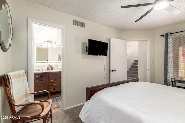 19230 N 5th St, Phoenix, AZ 85024 - bedroom with dark colored carpet, a textured ceiling, ensuite bath, and ceiling fan
