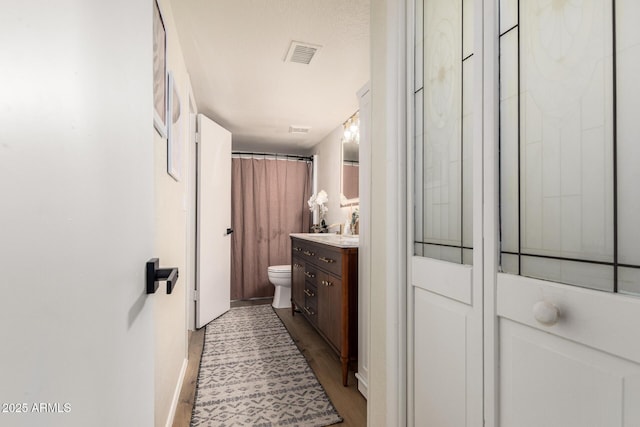 19230 N 5th St, Phoenix, AZ 85024 - bathroom with vanity, wood finished floors, and curtained shower