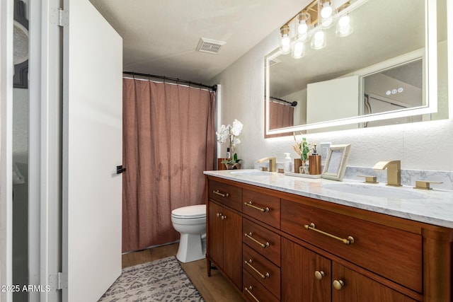 19230 N 5th St, Phoenix, AZ 85024 - bathroom with double vanity, wood finished floors, and curtained shower