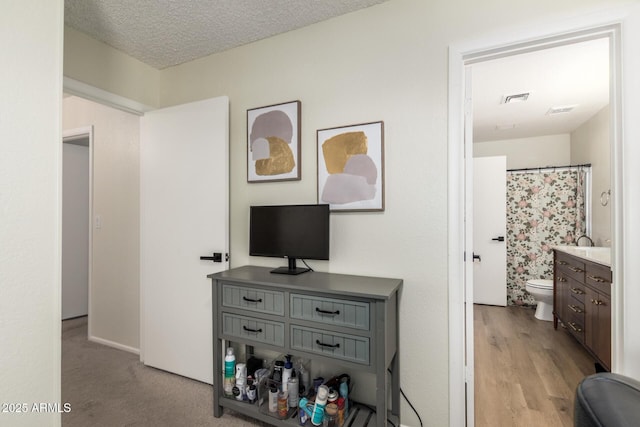 19230 N 5th St, Phoenix, AZ 85024 - bedroom with light wood-type flooring and ensuite bathroom