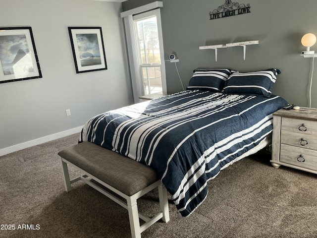 carpeted bedroom with baseboards