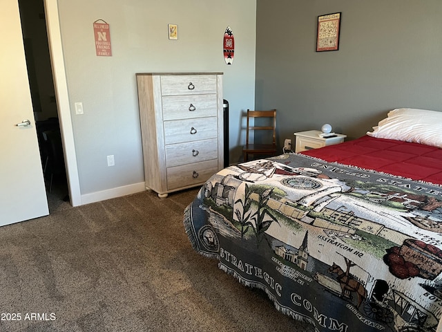 bedroom featuring dark colored carpet and baseboards