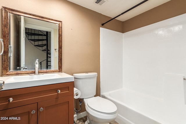 full bathroom with bathtub / shower combination, vanity with extensive cabinet space, and toilet