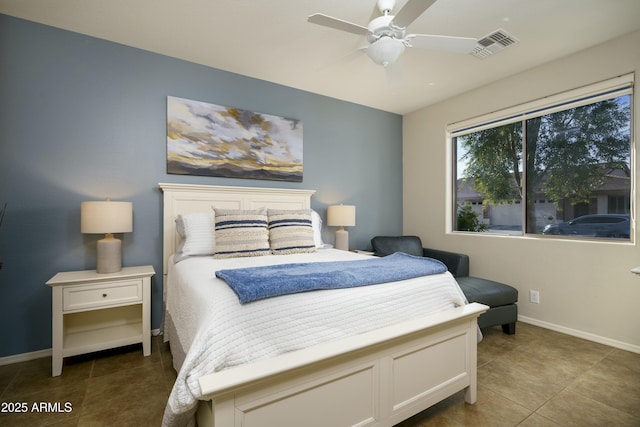 tiled bedroom featuring a ceiling fan, visible vents, and baseboards