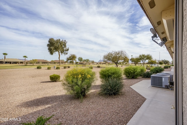 view of yard featuring central AC