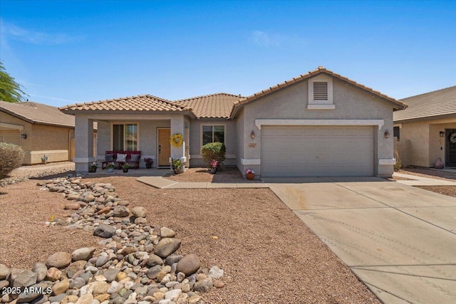 10235 E Jerome Ave, Mesa, AZ 85209 - view of front facade featuring stucco siding, a tiled roof, an attached garage, and concrete driveway