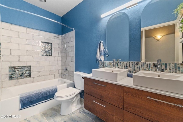 10235 E Jerome Ave, Mesa, AZ 85209 - full bath with double vanity, tub / shower combination, and decorative backsplash