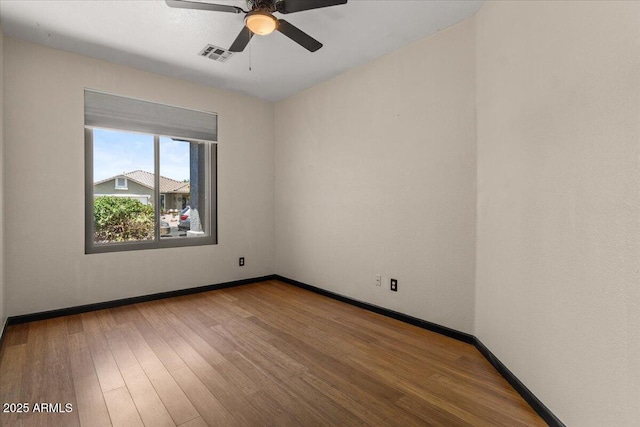 10235 E Jerome Ave, Mesa, AZ 85209 - empty room featuring ceiling fan and wood finished floors