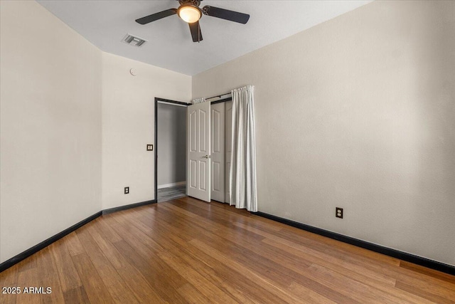 10235 E Jerome Ave, Mesa, AZ 85209 - empty room featuring ceiling fan and wood finished floors