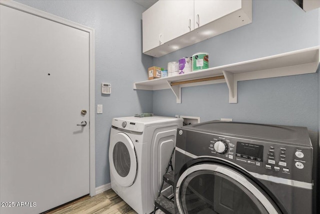 10235 E Jerome Ave, Mesa, AZ 85209 - laundry area featuring cabinet space, separate washer and dryer, and light wood-type flooring