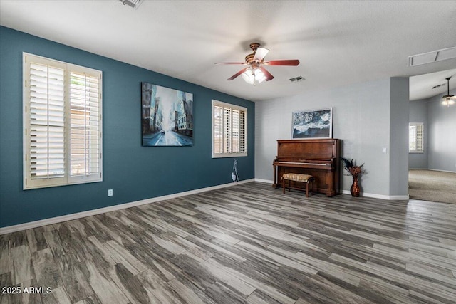 10235 E Jerome Ave, Mesa, AZ 85209 - living area with ceiling fan, plenty of natural light, and wood finished floors