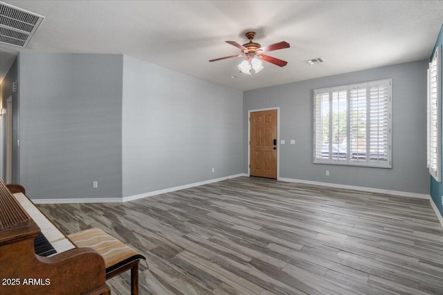 10235 E Jerome Ave, Mesa, AZ 85209 - unfurnished living room featuring wood finished floors and a ceiling fan