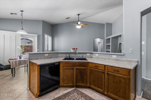 10235 E Jerome Ave, Mesa, AZ 85209 - kitchen featuring dishwasher, light tile patterned floors, a ceiling fan, light countertops, and vaulted ceiling