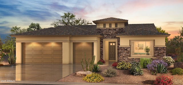 16578 W Mulberry Dr, Goodyear, AZ 85395 - view of front of property with stucco siding, stone siding, and a garage