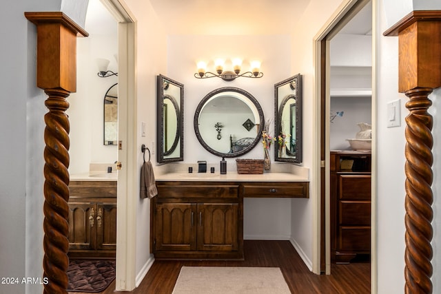 bathroom with vanity and hardwood / wood-style flooring