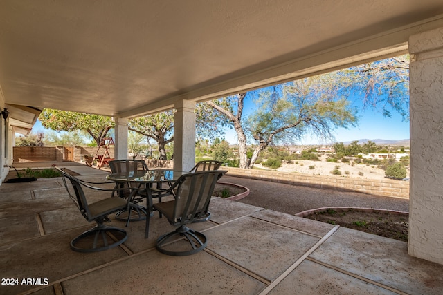 view of patio / terrace featuring a mountain view