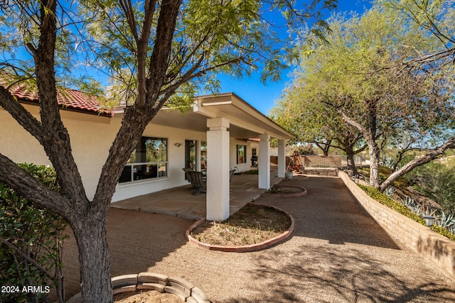 back of property with a patio area