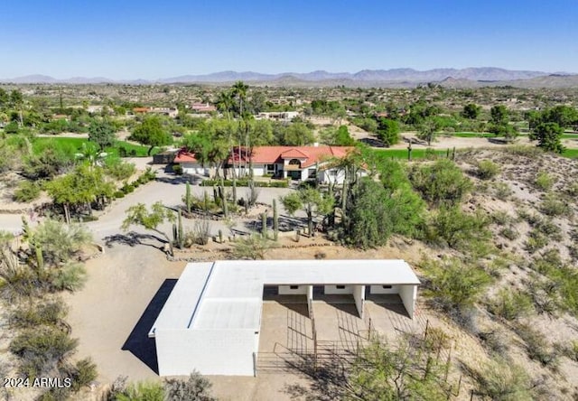 birds eye view of property featuring a mountain view