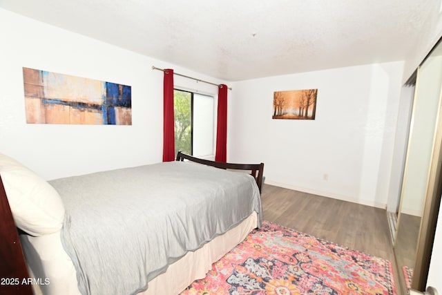 7777 E Main St Unit 227, Scottsdale, AZ 85251 - bedroom featuring wood finished floors and baseboards