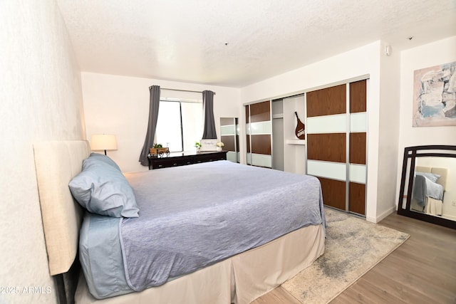 7777 E Main St Unit 227, Scottsdale, AZ 85251 - bedroom featuring wood finished floors