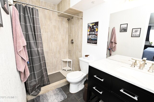 7777 E Main St Unit 227, Scottsdale, AZ 85251 - bathroom with tile patterned floors, vanity, and a tile shower