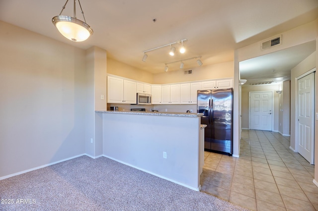 kitchen with stainless steel microwave, fridge with ice dispenser, white cabinetry, visible vents, and a peninsula