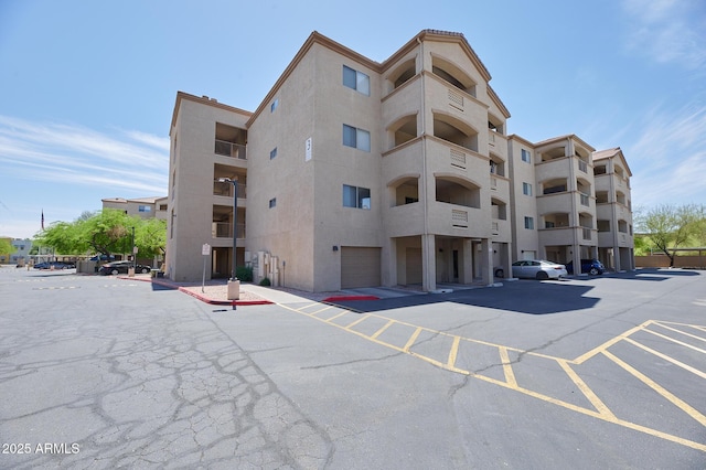 view of property with uncovered parking