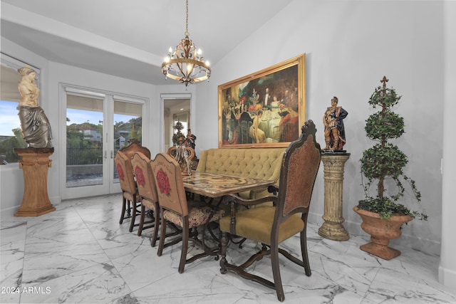 dining room featuring a chandelier and vaulted ceiling