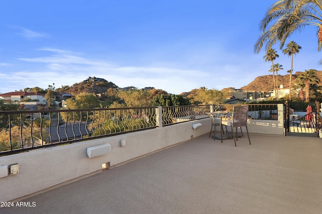 view of patio / terrace featuring a mountain view and a balcony