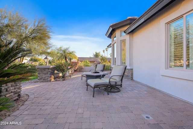 view of patio / terrace featuring a fire pit