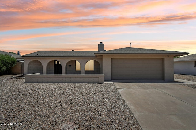 2519 E Geneva Dr, Tempe, AZ 85282 - view of front facade featuring an attached garage, driveway, a porch, and a chimney