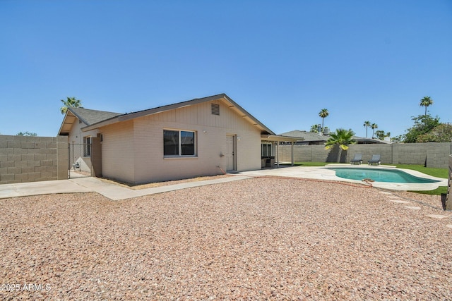 2519 E Geneva Dr, Tempe, AZ 85282 - back of property with a fenced backyard, a patio, and brick siding