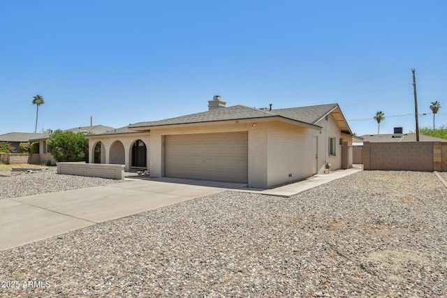 2519 E Geneva Dr, Tempe, AZ 85282 - ranch-style home with a garage, concrete driveway, a chimney, roof with shingles, and brick siding