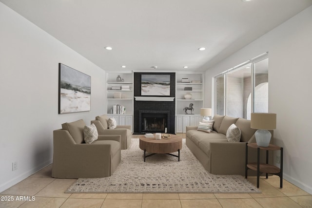 2519 E Geneva Dr, Tempe, AZ 85282 - tiled living area featuring a brick fireplace, recessed lighting, and built in shelves