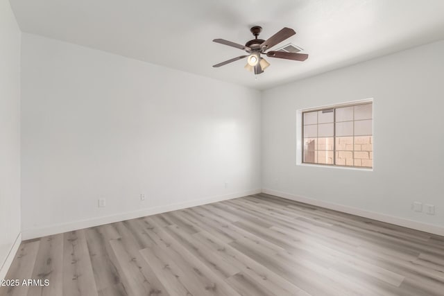 spare room with ceiling fan and light hardwood / wood-style flooring