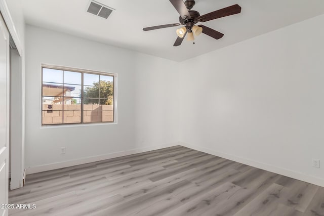 unfurnished room with ceiling fan and light hardwood / wood-style flooring