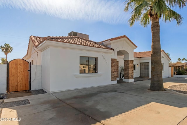 mediterranean / spanish-style home featuring a garage