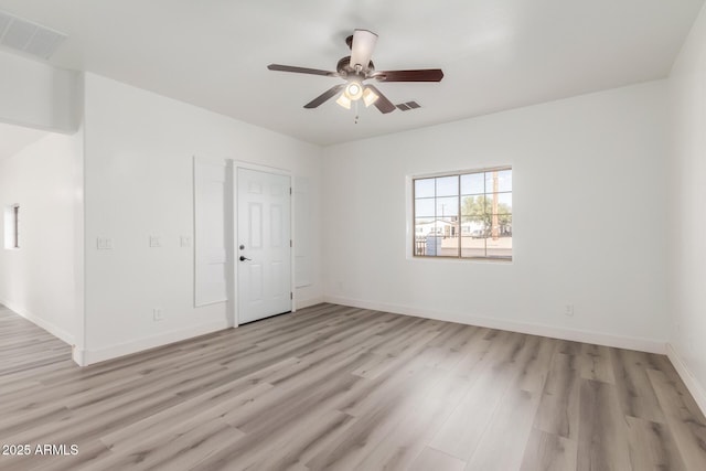 unfurnished room with ceiling fan and light wood-type flooring