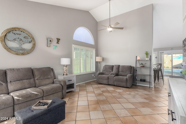 tiled living room featuring high vaulted ceiling and ceiling fan